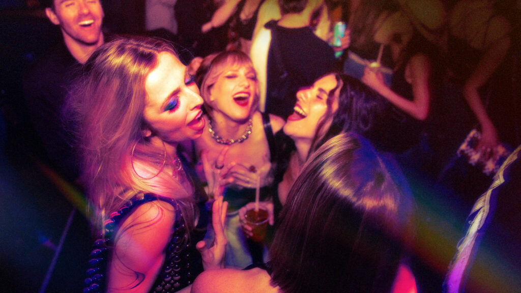 A group of girls dancing and singing at Club Honey